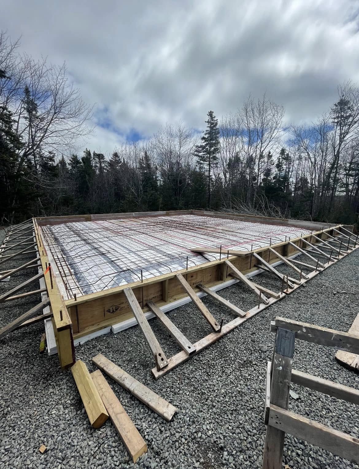 Rebar grid laid inside foundation forms before the pour